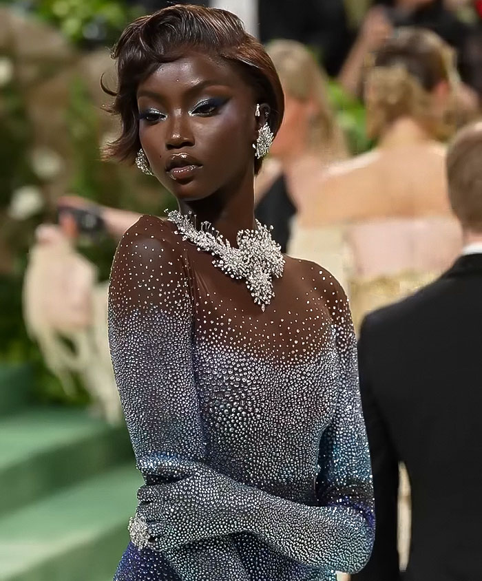 Anok Yai, elegant model in a sparkling gown at Met Gala event, showcasing style and grace in the fashion industry. Anok Yai, elegant model in a sparkling gown at Met Gala event, showcasing style and grace in the fashion industry.