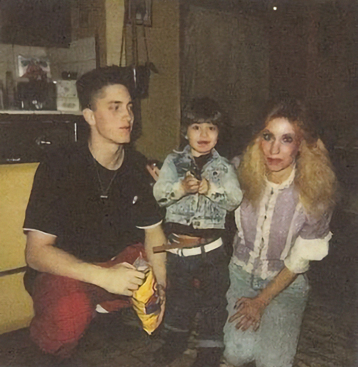 Family photo with Eminem's half-brother Nate and their mother, showing a candid moment from the past. Family photo with Eminem's half-brother Nate and their mother, showing a candid moment from the past.