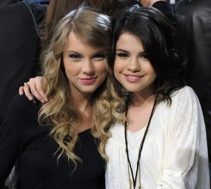 Selena Gomez and Taylor Swift posing together at an event. Selena Gomez and Taylor Swift posing together at an event.