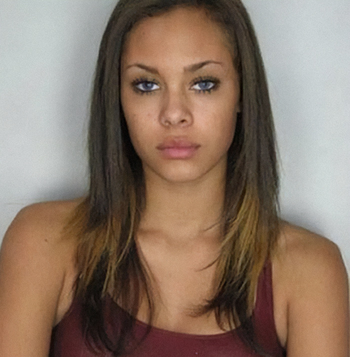 Viral mugshot of Gabrielle Hill with long hair and a serious expression. Viral mugshot of Gabrielle Hill with long hair and a serious expression.