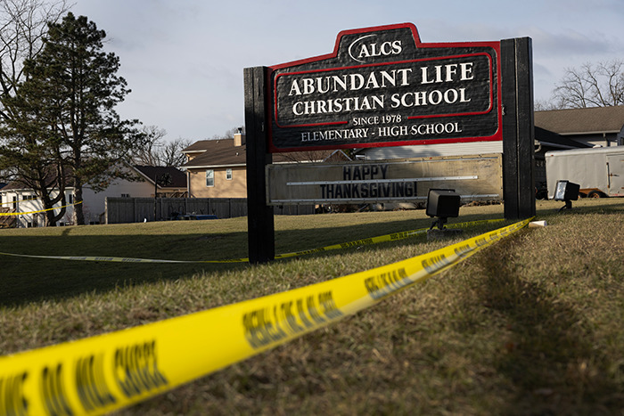 Yellow caution tape surrounds Abundant Life Christian School sign after Wisconsin tragedy. Yellow caution tape surrounds Abundant Life Christian School sign after Wisconsin tragedy.