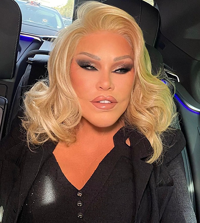 Catwoman Jocelyn Wildenstein, 84, with smooth skin, sitting in a car wearing a black outfit in Paris. Catwoman Jocelyn Wildenstein, 84, with smooth skin, sitting in a car wearing a black outfit in Paris.
