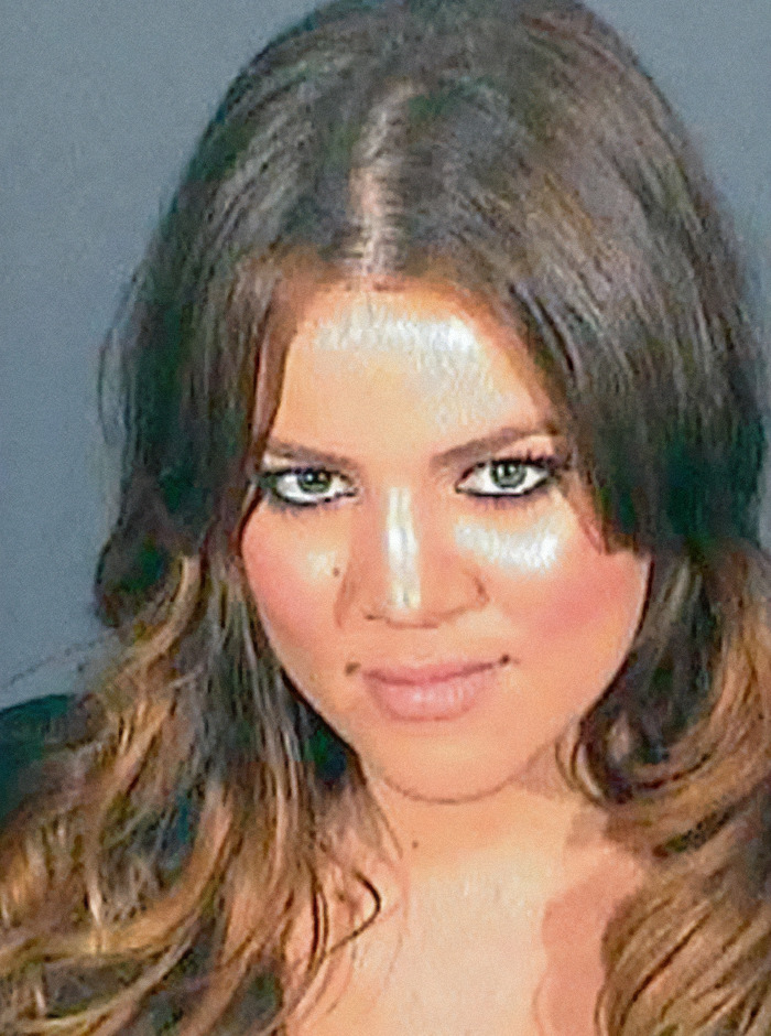 Khloe Kardashian with long, wavy hair and intense eye makeup in a viral criminal heartthrob mugshot. Khloe Kardashian with long, wavy hair and intense eye makeup in a viral criminal heartthrob mugshot.