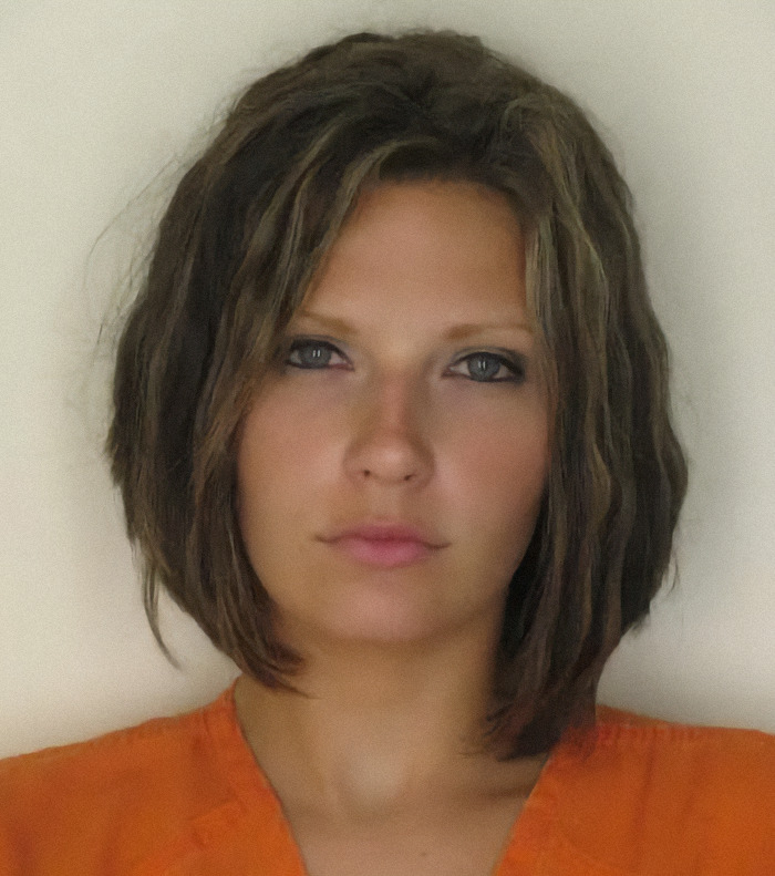 Meagan Simmons in a mugshot wearing an orange jumpsuit, representing viral mugshots of criminal heartthrobs. Meagan Simmons in a mugshot wearing an orange jumpsuit, representing viral mugshots of criminal heartthrobs.
