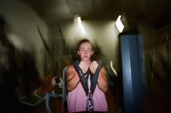 Sydney Sweeney in a gym working out, wearing a pink top, focused on exercise, in response to body shamers after viral bikini shots. Sydney Sweeney in a gym working out, wearing a pink top, focused on exercise, in response to body shamers after viral bikini shots.