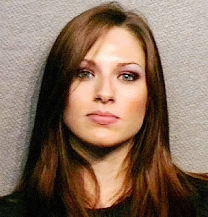 Viral mugshot of a woman with brown hair and striking eyes, part of the criminal heartthrobs trend. Viral mugshot of a woman with brown hair and striking eyes, part of the criminal heartthrobs trend.
