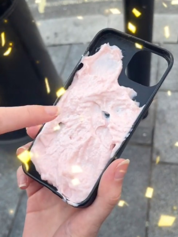 Phone with a unique anti-snatching hack applied, covered in pink substance. Phone with a unique anti-snatching hack applied, covered in pink substance.