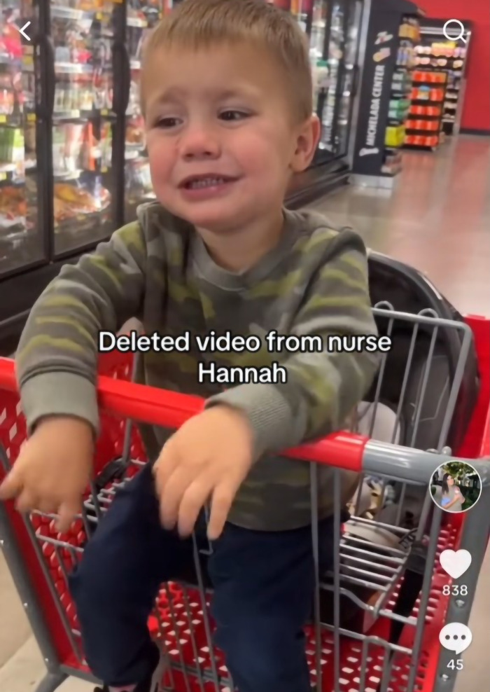 Child in a shopping cart, looking distressed. Viral momfluencer criticized for sharing video of son flinching at dad. Child in a shopping cart, looking distressed. Viral momfluencer criticized for sharing video of son flinching at dad.