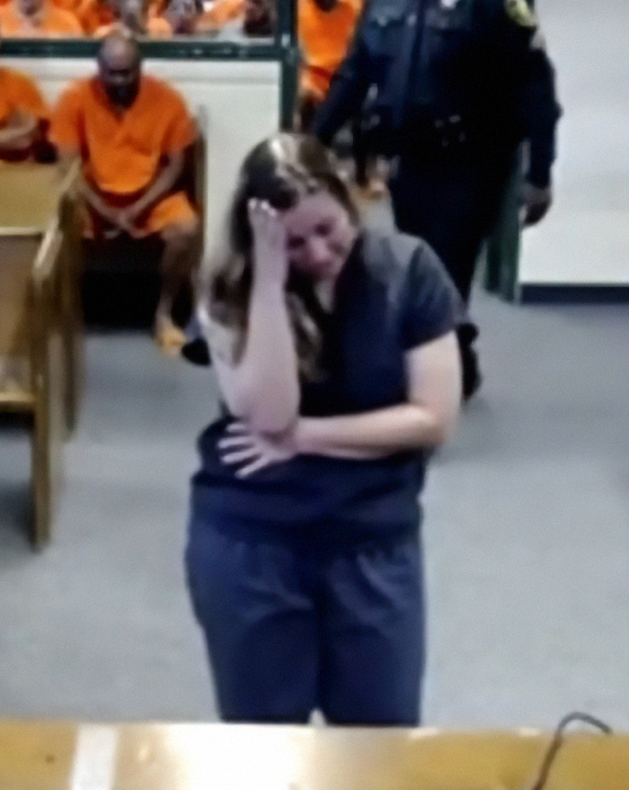 Briana Boston in courtroom, emotional during hearing. Briana Boston in courtroom, emotional during hearing.