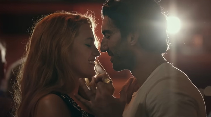 Justin Baldoni and Blake Lively smiling closely in a scene from "It Ends With Us. Justin Baldoni and Blake Lively smiling closely in a scene from "It Ends With Us.