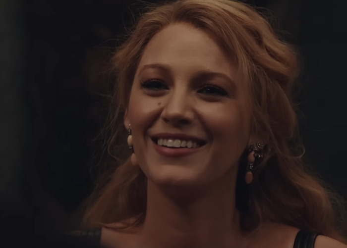 Blake Lively smiles brightly in a dimly lit setting, wearing elegant earrings; related to Justin Baldoni's news on boundaries. Blake Lively smiles brightly in a dimly lit setting, wearing elegant earrings; related to Justin Baldoni's news on boundaries.