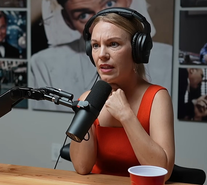 Ex-Scientologist Jenna Miscavige in podcast, wearing headphones, discussing alleged brainwashing experiences. Ex-Scientologist Jenna Miscavige in podcast, wearing headphones, discussing alleged brainwashing experiences.