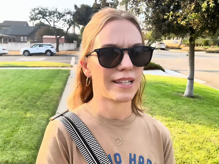 Ex-Scientologist Jenna Miscavige in sunglasses and casual attire outdoors, discussing alleged brainwashing practices. Ex-Scientologist Jenna Miscavige in sunglasses and casual attire outdoors, discussing alleged brainwashing practices.