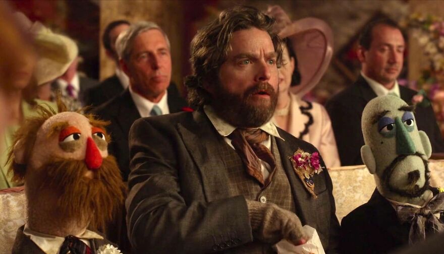 Actor Zach Galifianakis with puppets at a formal event, showcasing the theme of actors who always play themselves.