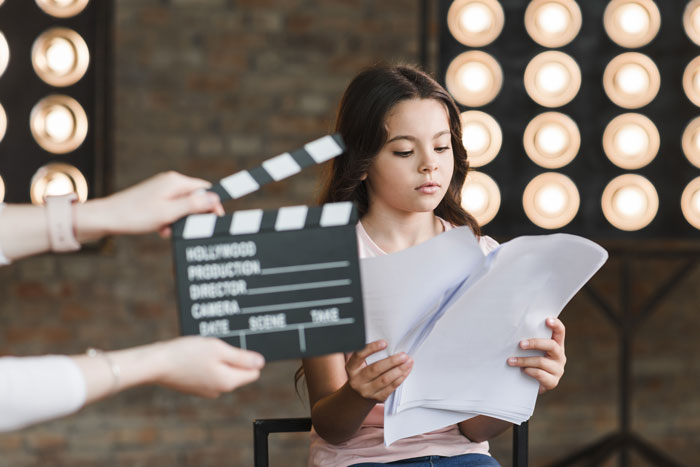 Young actress reviewing script during audition, highlighting non-famous actress reality. Young actress reviewing script during audition, highlighting non-famous actress reality.