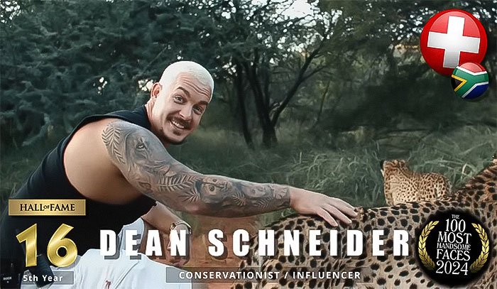 Man smiling with a cheetah, ranked in The Most Handsome Men of 2024 list, showcasing tattoos outdoors. Man smiling with a cheetah, ranked in The Most Handsome Men of 2024 list, showcasing tattoos outdoors.