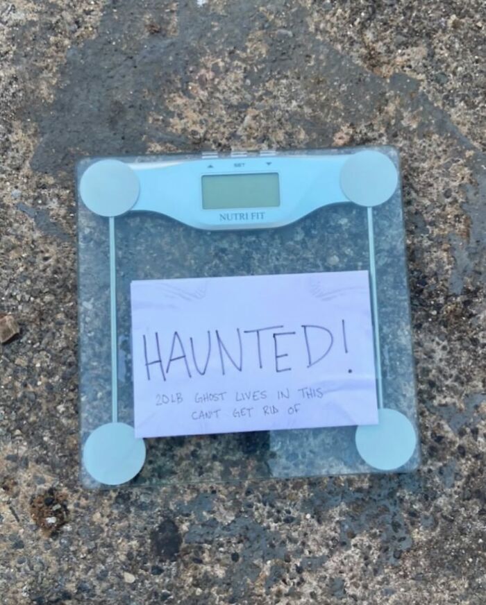 Funny picture of a scale labeled "Haunted" on a New York street.