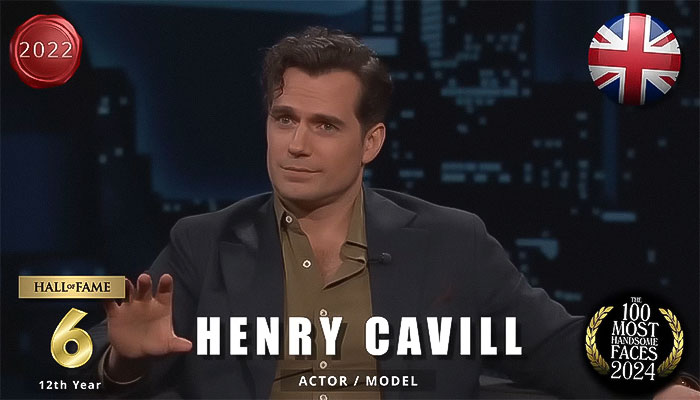 Actor seated, named among the most handsome men of 2024, wearing a dark suit and shirt, in a formal setting. Actor seated, named among the most handsome men of 2024, wearing a dark suit and shirt, in a formal setting.