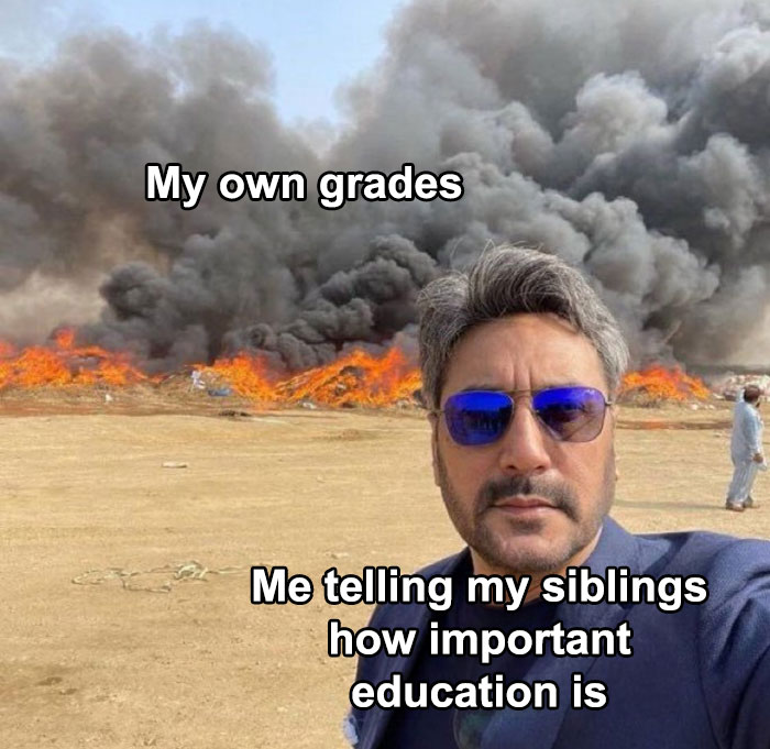 Man in sunglasses taking a selfie in front of a fire with text overlay about grades and education, showcasing science memes humor.