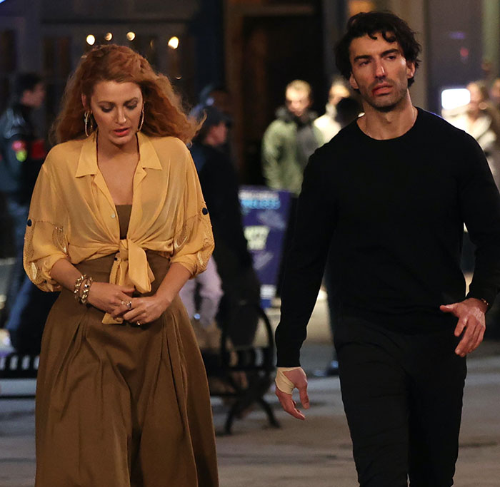 Justin Baldoni and a woman walking on a busy street at night, highlighting lawyer claims about truth exposure. Justin Baldoni and a woman walking on a busy street at night, highlighting lawyer claims about truth exposure.