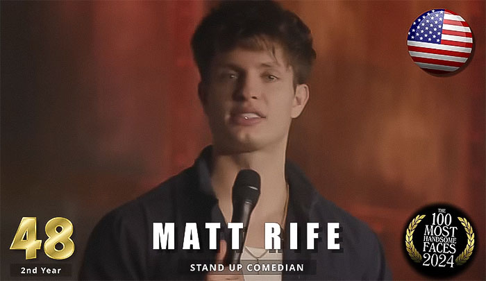 Stand-up comedian holding a microphone, ranked among the most handsome men of 2024 by The Independent Critics. Stand-up comedian holding a microphone, ranked among the most handsome men of 2024 by The Independent Critics.