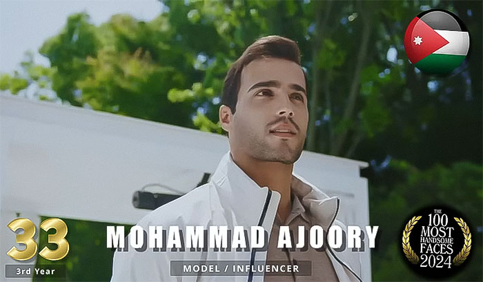 Man ranked among most handsome in 2024, wearing a white jacket outdoors. Image features a Jordan flag and ranking emblem. Man ranked among most handsome in 2024, wearing a white jacket outdoors. Image features a Jordan flag and ranking emblem.