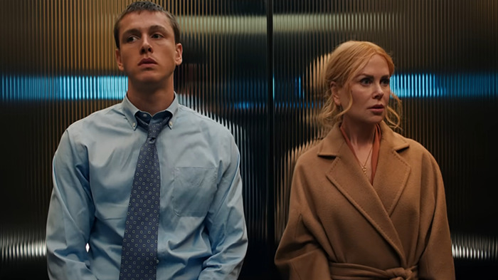 Nicole Kidman and co-star Harris Dickinson in an elevator scene from movie 'Babygirl', one in a suit and the other wearing a coat. Nicole Kidman and co-star Harris Dickinson in an elevator scene from movie 'Babygirl', one in a suit and the other wearing a coat.