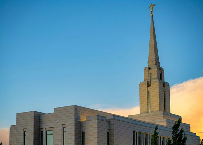 Mormon temple with golden spire at sunset, showcasing architectural beauty and spiritual significance. Mormon temple with golden spire at sunset, showcasing architectural beauty and spiritual significance.