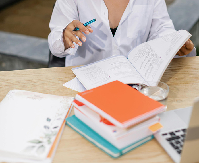 Woman studying at a desk. Woman studying at a desk.