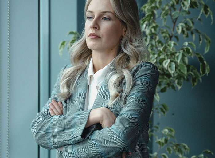 Woman looking concerned, reflecting on her eldest child moving out at 18. Woman looking concerned, reflecting on her eldest child moving out at 18.