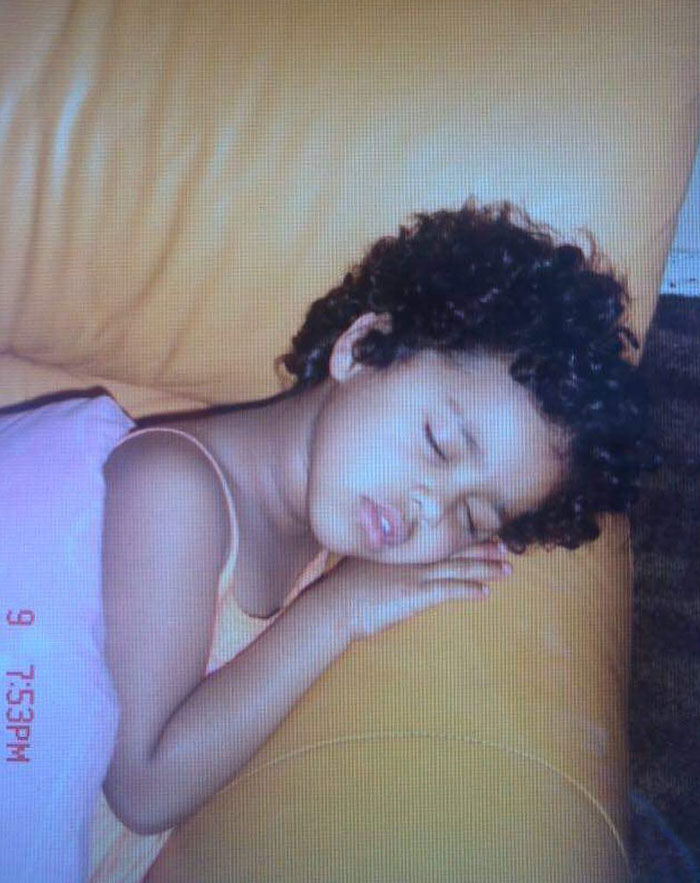 A young girl, identified as Tyla, around age 3-5, peacefully sleeping on a yellow couch, wearing a pink dress. Timestamp shows 7:53 PM. A young girl, identified as Tyla, around age 3-5, peacefully sleeping on a yellow couch, wearing a pink dress. Timestamp shows 7:53 PM.