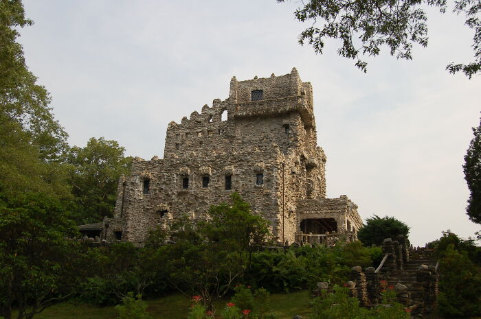 Medieval-style castle surrounded by lush greenery, showcasing one of the amazing views states have to offer.