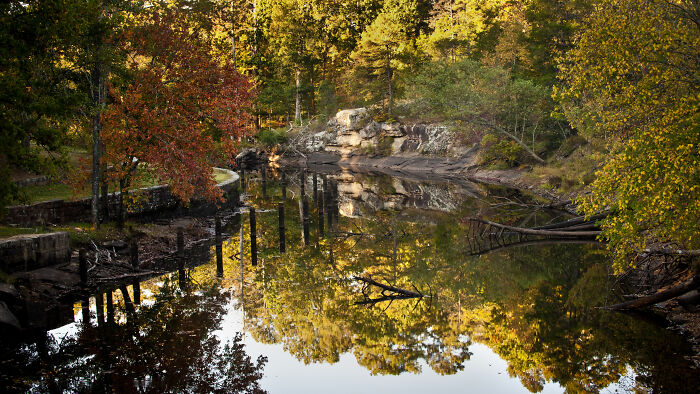 Beautiful autumn landscape reflecting on a calm river, showcasing amazing views in the states.