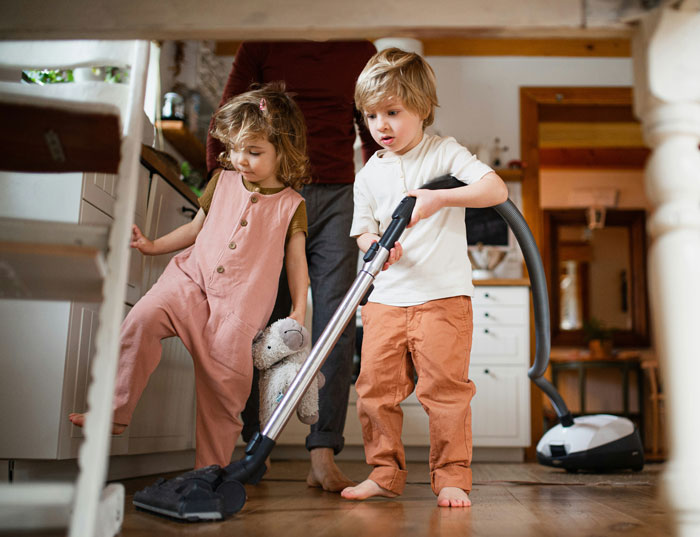 Children doing chores at home, a scene reflecting parenting insights on chores without pay. Children doing chores at home, a scene reflecting parenting insights on chores without pay.