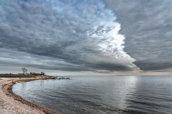 Spectacular coastal view with dramatic clouds over the ocean, highlighting amazing views in various states.