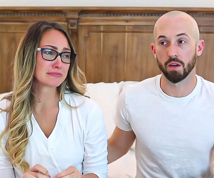 YouTubers discussing a serious topic on camera, sitting together in a room. YouTubers discussing a serious topic on camera, sitting together in a room.