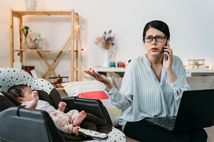 Woman on phone beside a baby, illustrating teen's refusal of babysitter role. Woman on phone beside a baby, illustrating teen's refusal of babysitter role.