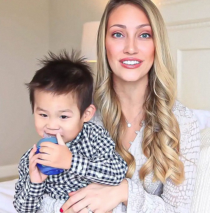 Woman with long hair and child holding a toy, related to YouTubers Myka and James Stauffer controversy. Woman with long hair and child holding a toy, related to YouTubers Myka and James Stauffer controversy.