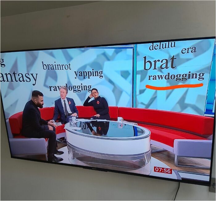 TV show discussing British slang with hosts on a red sofa, surrounded by humorous words like "brat" and "rawdogging."