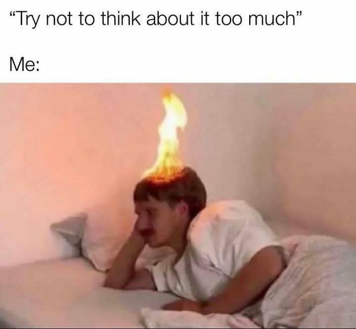 Person lying in bed with their head on fire, illustrating humor as a coping mechanism in a relatable meme format.