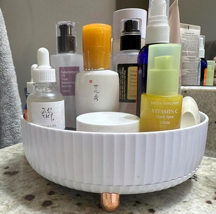 Organized bathroom skincare products in a white container on a countertop showcasing low-lift, high-impact improvements.