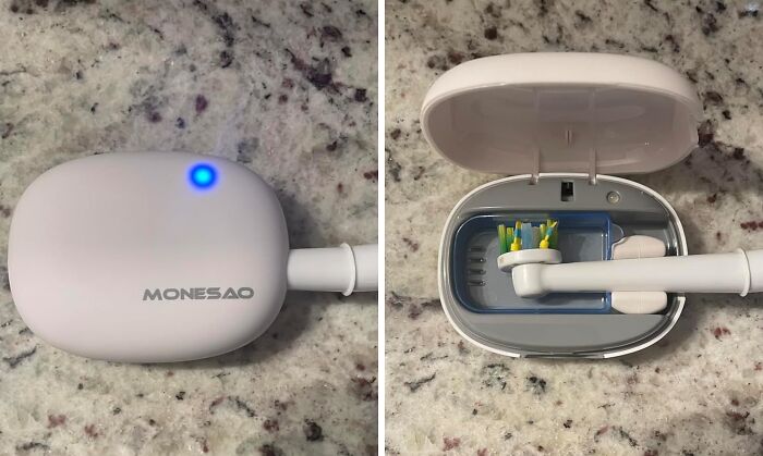 Travel toothbrush case with light, showing compact design on a marbled surface.