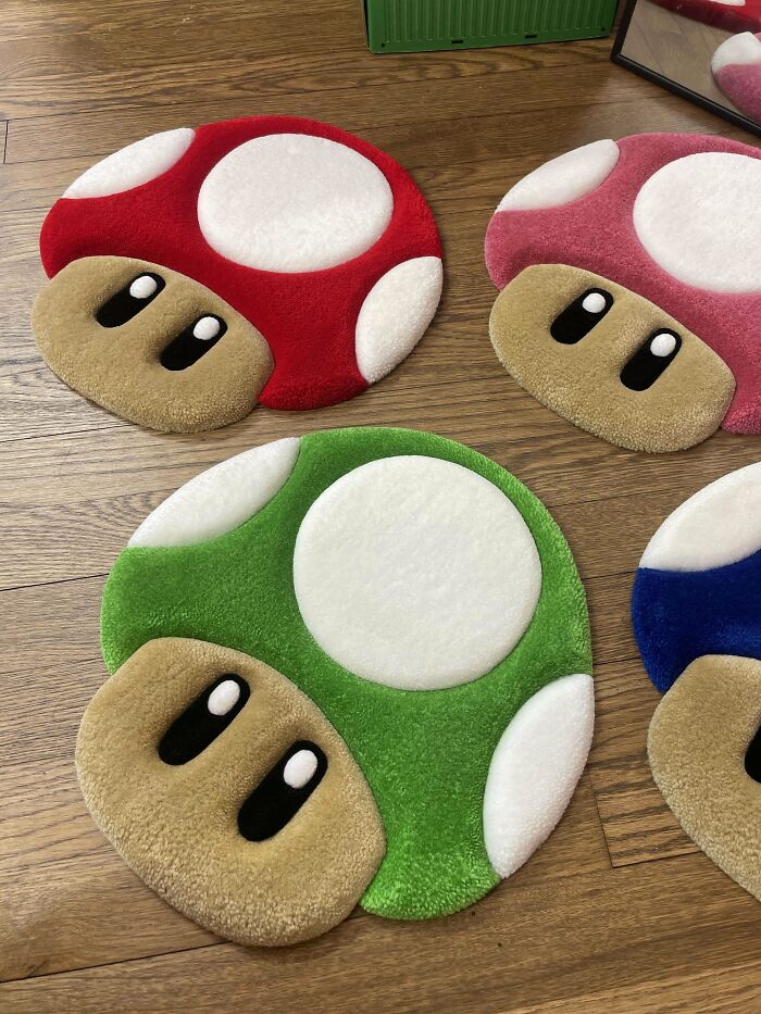 Colorful mushroom rugs on a wooden floor as part of a DIY project.