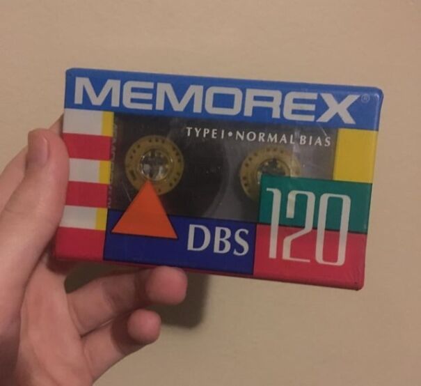 Retro Memorex cassette tape in hand, evoking sentimental nostalgia.