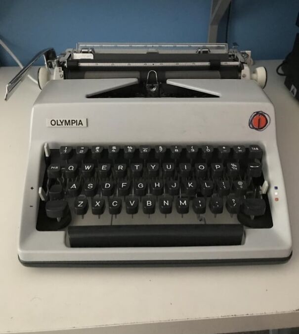 Retro Olympia typewriter on a desk, evoking nostalgia for the good old days.