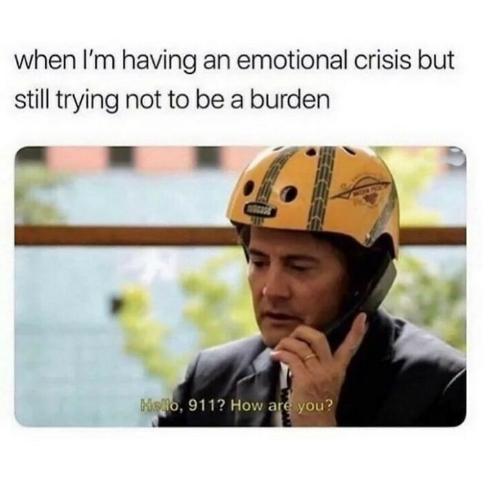 Man wearing a helmet on phone, caption about emotional crisis and humor as a coping mechanism meme.