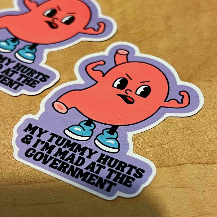 Cartoon stomach sticker expressing frustration; creative DIY project showcasing humor and emotion.