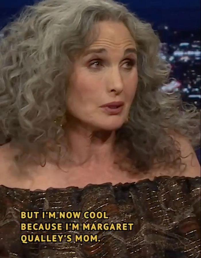 Woman with curly gray hair discussing "reverse nepotism" on a talk show. Woman with curly gray hair discussing "reverse nepotism" on a talk show.