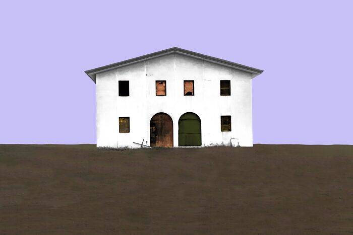 Minimalist image of a white house on a plain, representing Budapest International Foto Awards 2024 winners.