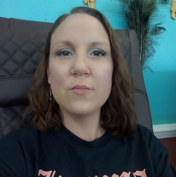 A woman with brown hair and a nose ring sits in a chair, claiming to be Cherrie Mahan who vanished in 1985. A woman with brown hair and a nose ring sits in a chair, claiming to be Cherrie Mahan who vanished in 1985.